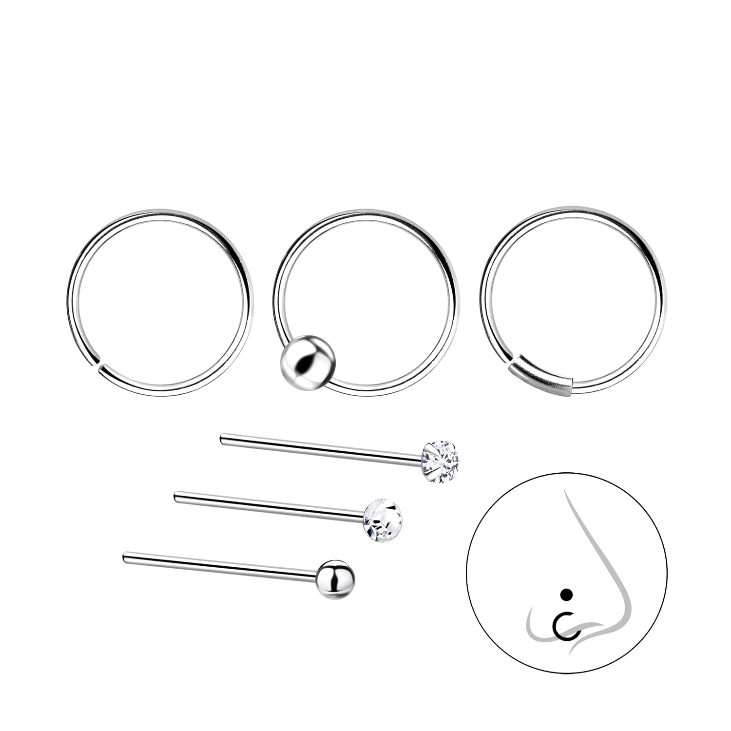 A selection of silver body jewellery on a white background